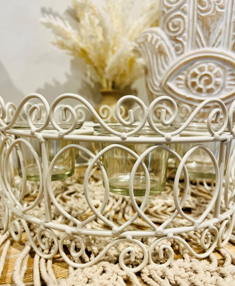 
                  
                    Round decorative metal 6x tea light holder
                  
                