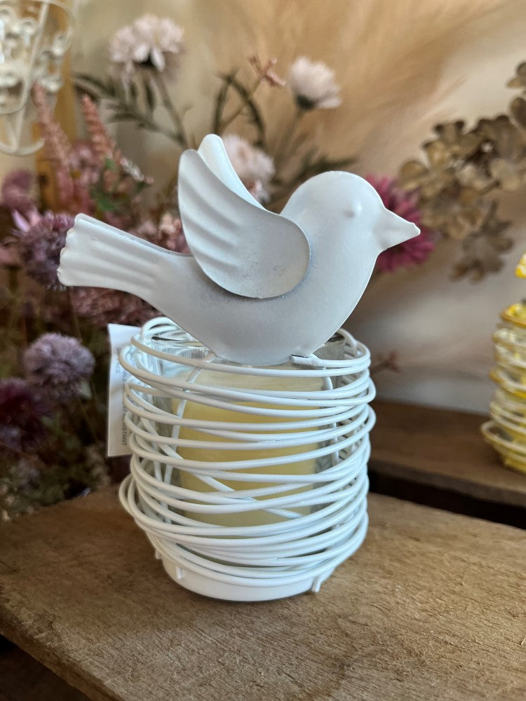 
                  
                    Metal tea light with decorative bird & glass holder
                  
                
