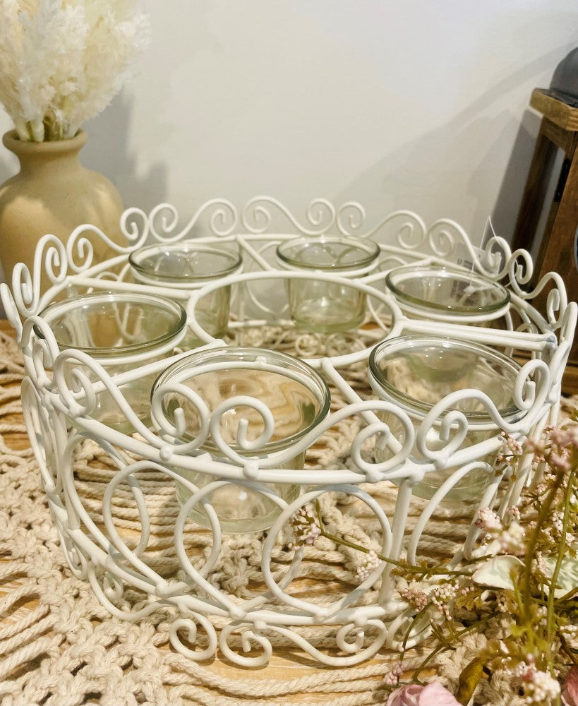
                  
                    Round decorative metal 6x tea light holder
                  
                