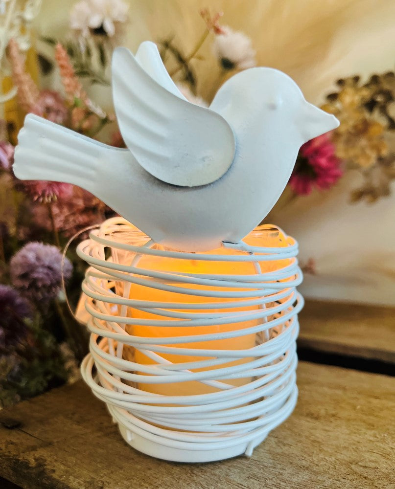 
                  
                    Metal tea light with decorative bird & glass holder
                  
                